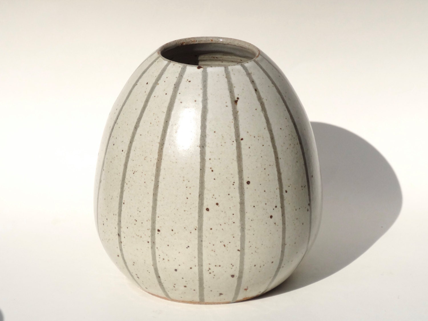 Handmade white ceramic vase with grey stripes