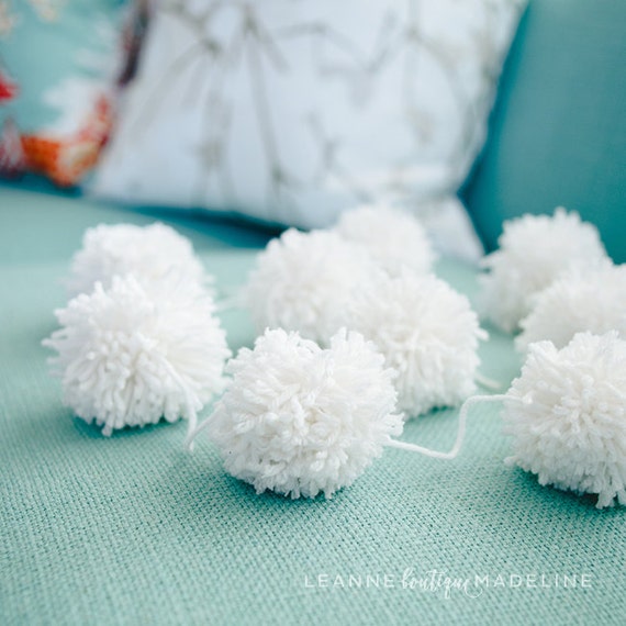white yarn pom pom garland by leannemadeline on Etsy