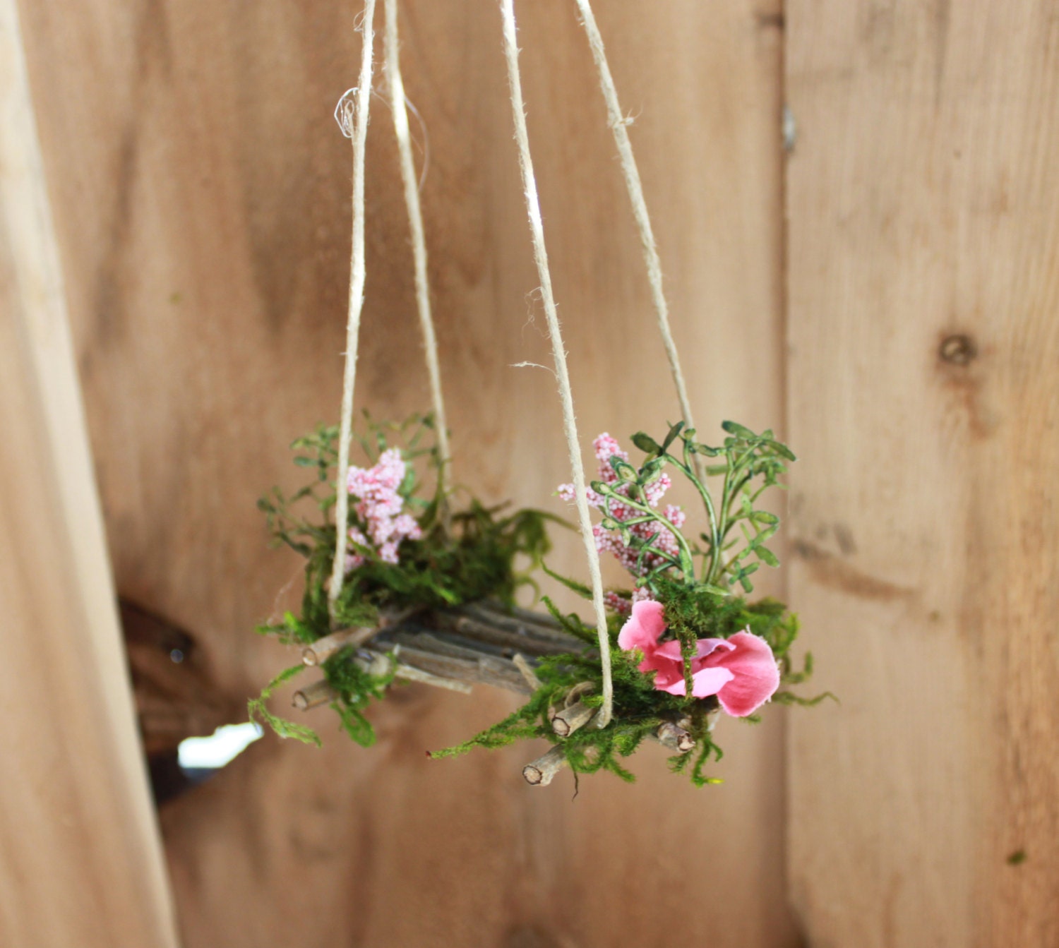 fairy on a swing garden ornament