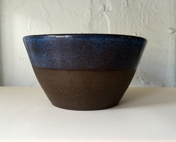 Modern ceramic black clay bowls in blue.