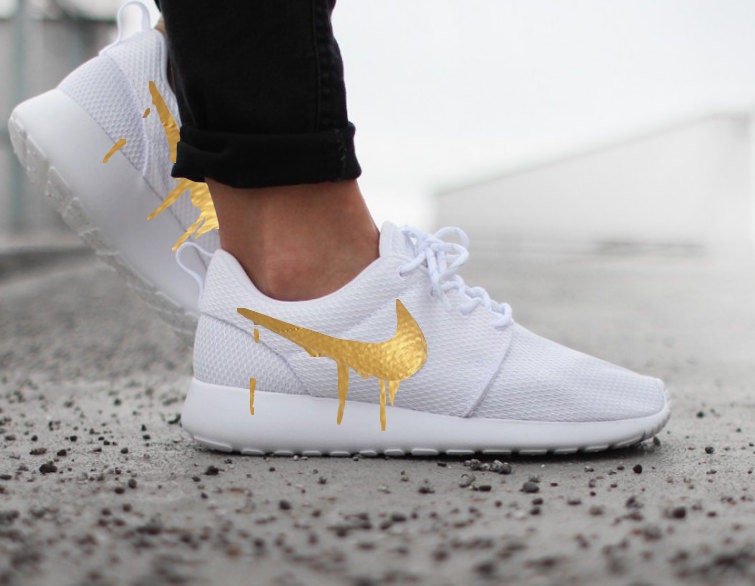 womens white nike shoes with gold swoosh