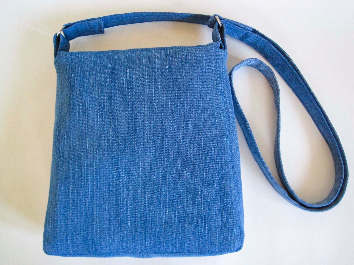 Blue denim crossbody bag made from upcycled fabric appliqued