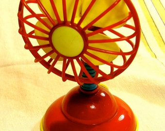 toy fan, bright plastic, battery operated fan