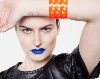 Lucite neon orange bracelet, minimal perspex cuff.