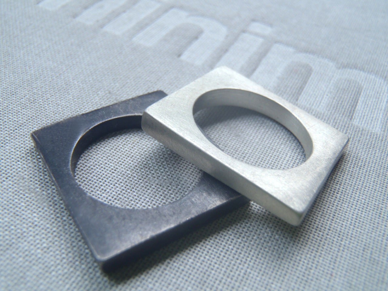 Rectangular stackable solid ring in brushed or blacked