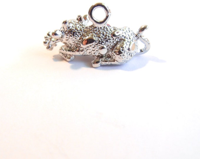 Small Silver-tone Rhinestone Accented Laying Bull with Flower Charm