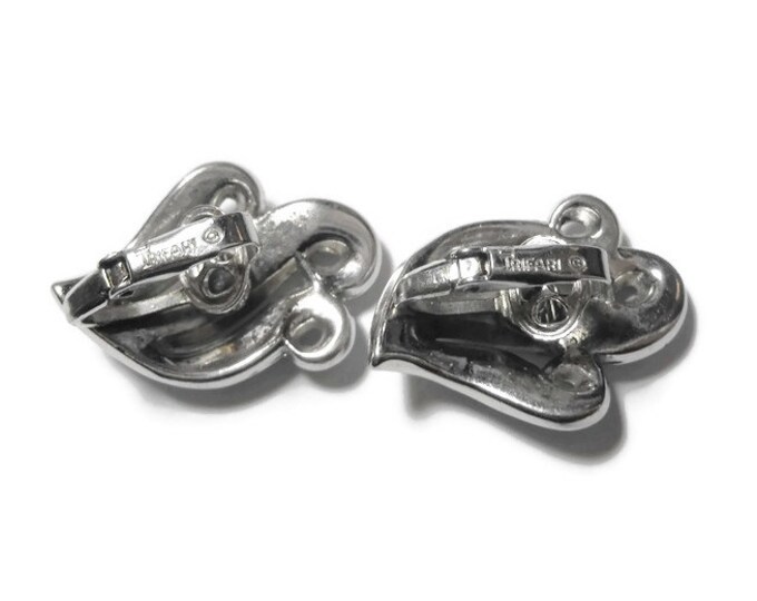 Crown Trifari earrings 1950s early 60s, silver wave clip earrings, brushed silver with glossy silver edges, subtle sophistication