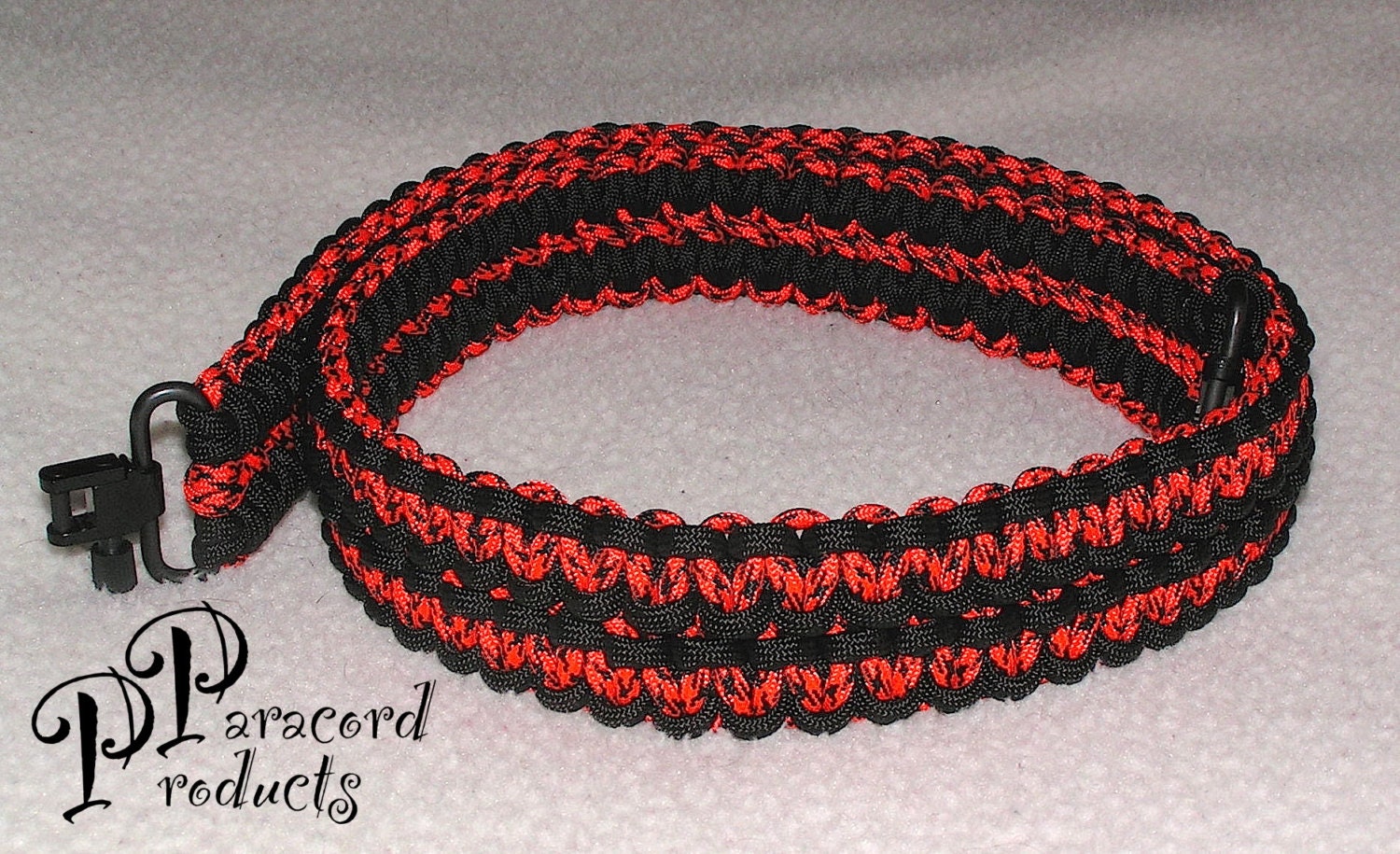A Double Cobra Stitch Paracord Gun Sling made of Black and