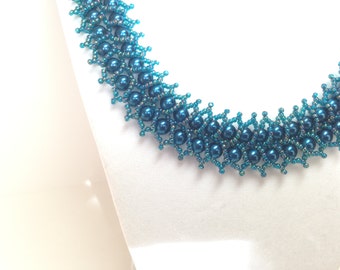Teal double row pearl necklace.