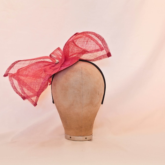 Handmade hot pink asymmetric bow ladies hat with jewel detailing