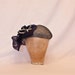 Handmade navy and white ladies occasion hat, decorated with asymmetric frill and beading detail