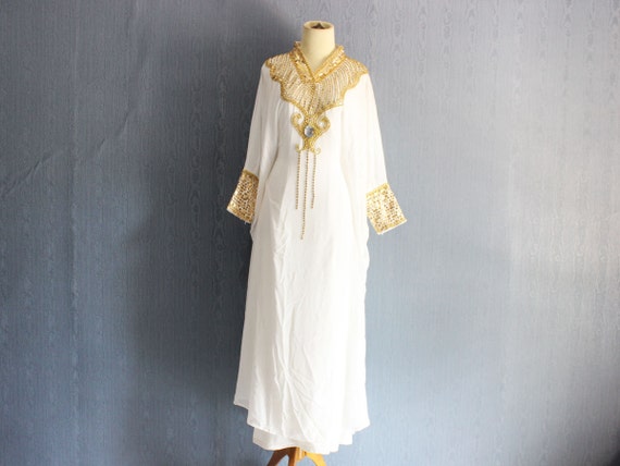 white and gold kaftan
