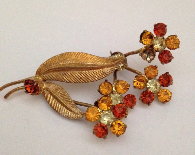 Storewide 25% Off SALE Vintage Gold Tone Amber Rhinestone Encrusted Daisy Flower Designer Brooch Featuring Etched Leaf Style Accents