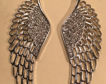Sterling Silver Angel Wing Earrings with Swarovski Crystals embedded.
