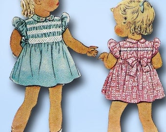 1940s Vintage McCall Sewing Pattern 878 Toddler Girls Dress with Smocking Size 2