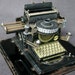 The Elegant black antique toy typewriter. Vintage collectible writing embossing portable tool.