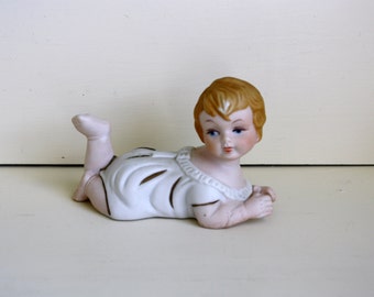 Bisque Porcelain Piano Baby Crawling Figurine