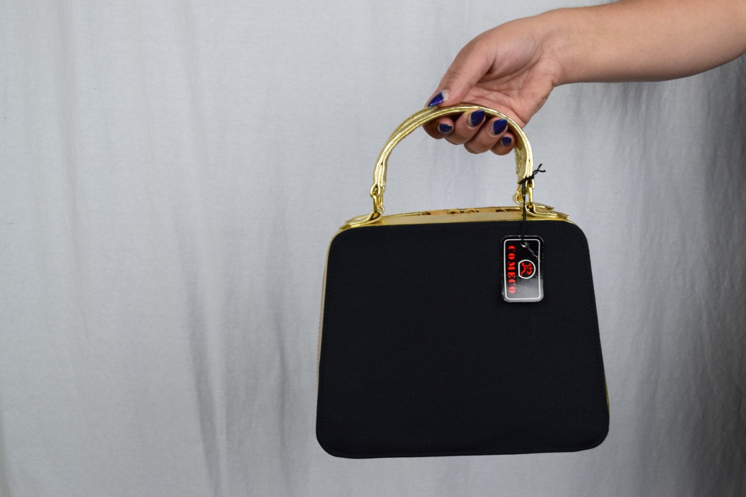 black handbag with gold detail