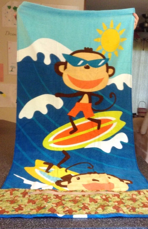 Beach towel with zippered pocket