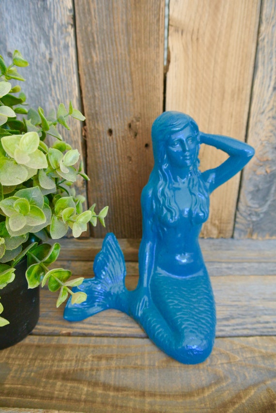 large outdoor mermaid statues