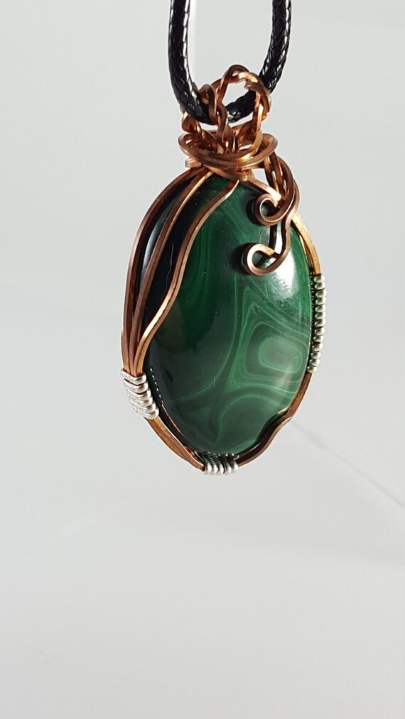 Large oval malachite cabochon wrapped in copper and sterling