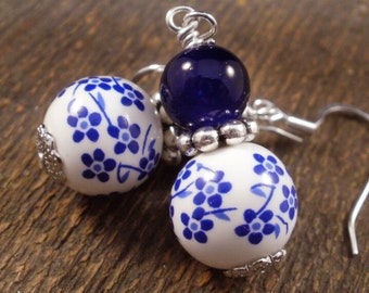 Royal blue flowers and white ceramic beads, glass and silver handmade earrings