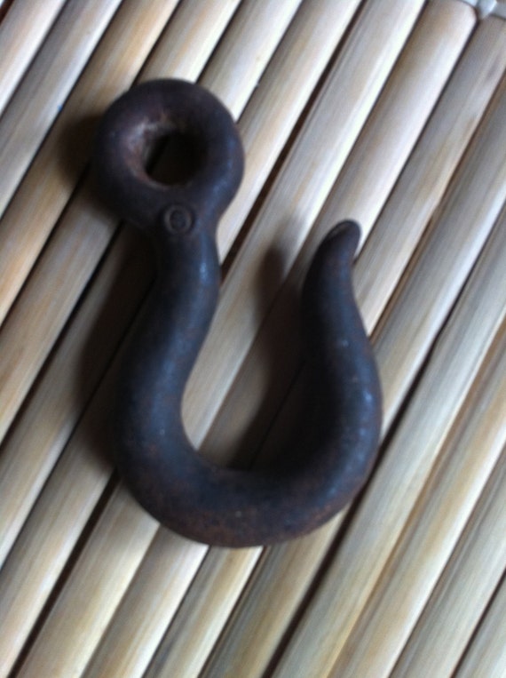 antique hook use to hang a plant a pot or clothes iron