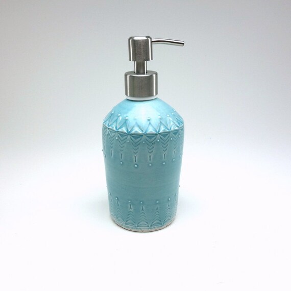 Blue glazed porcelain soap dispenser with stamped pattern and