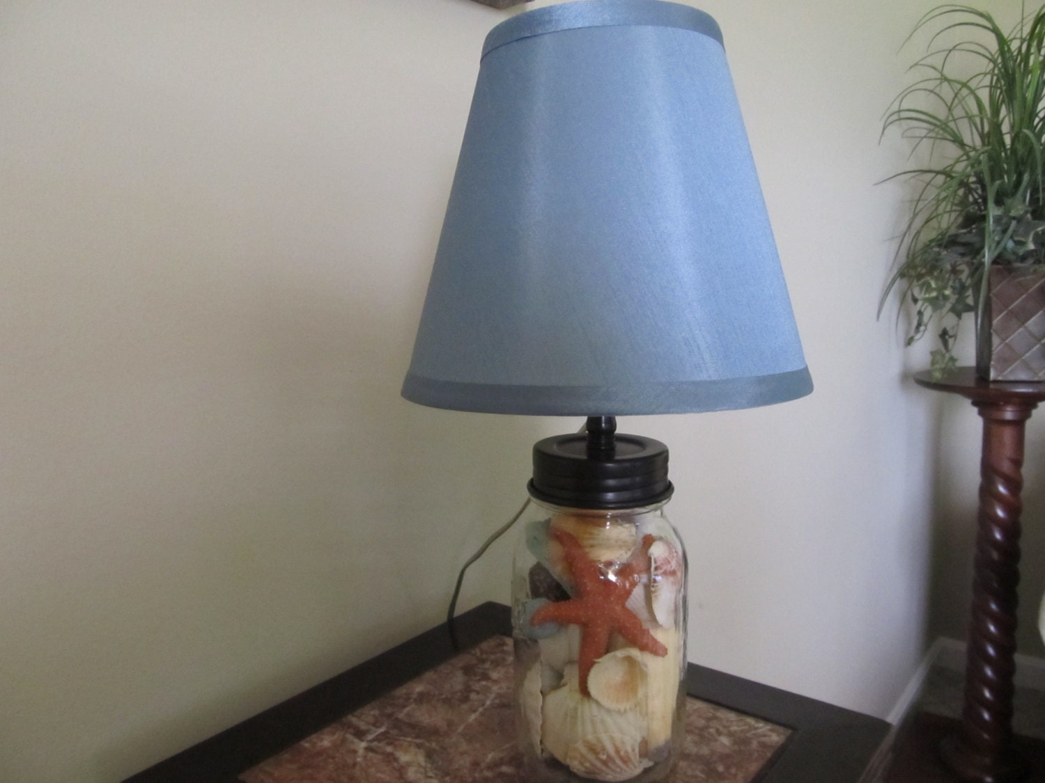 Seashells in a jar lamp