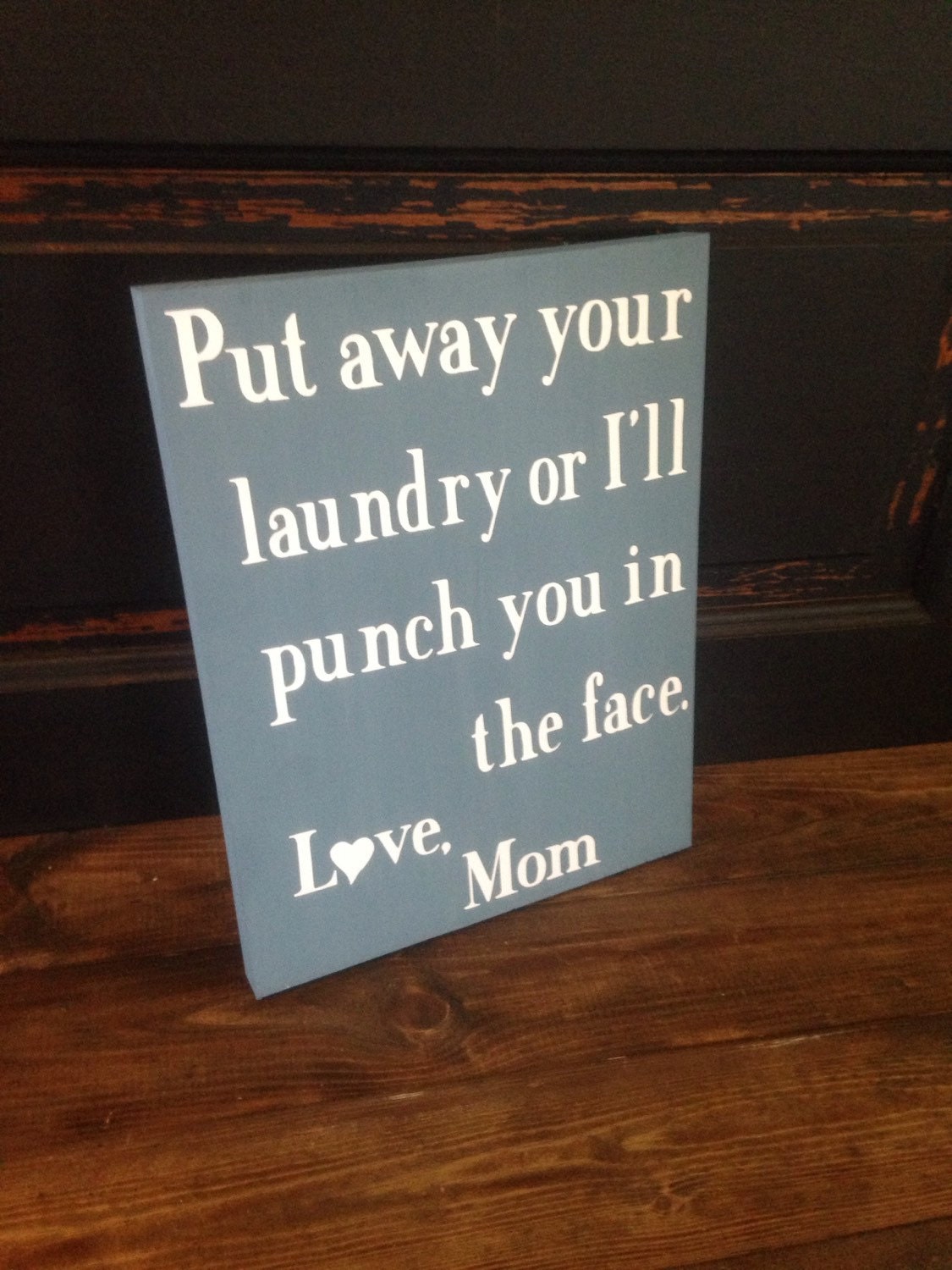 Put away your laundry or I'll punch you in the face sign