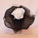 Stunning black frill side hat with white rose decoration