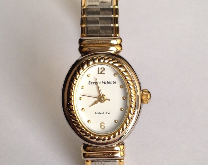 Storewide 25% Off SALE Vintage Ladies Textured Two Tone Gold & Silver Sergio Valente Designer Quartz Watch Featuring Flexible Designer Band