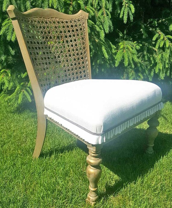 Cane Chair chalk painted and distressed with gold leaf and