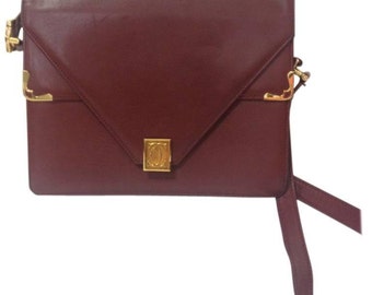 90's vintage Cartier double flap envelope shoulder bag with gold-tone logo charm closure and frames. Classic purse from Must de Cartier
