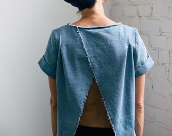 Open back top in light blue denim with raw edges