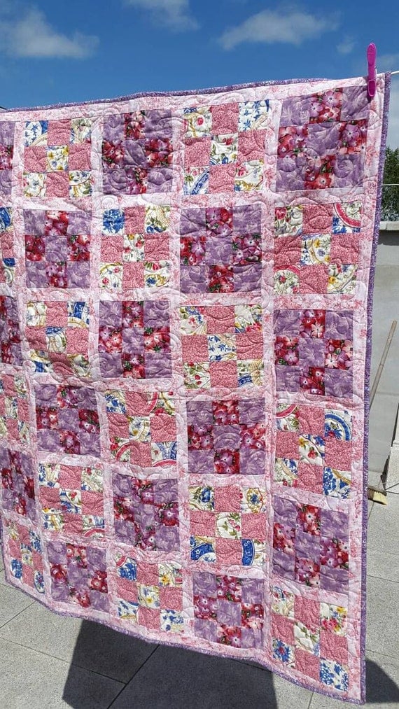 floral-pink-and-purple-cot-quilt-with-matching-dolly-quilt