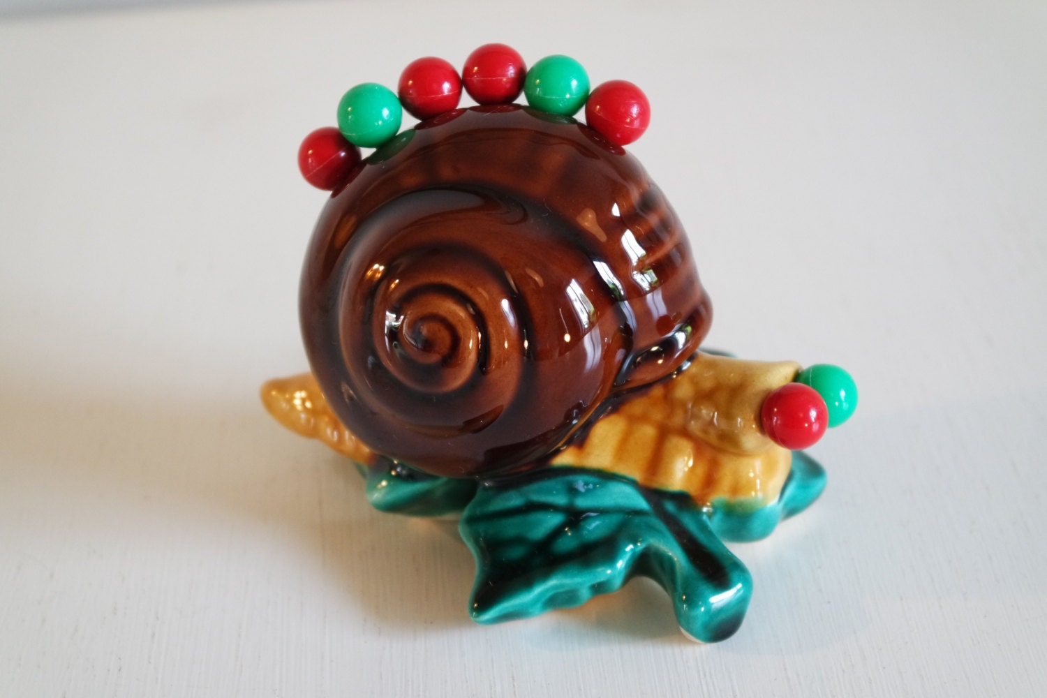 Vintage 50′ Vallauris cocktail picks in a snail Haute Juice