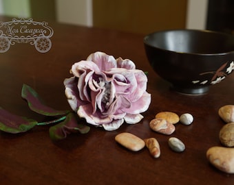 Leather flower. Sprig of rose.