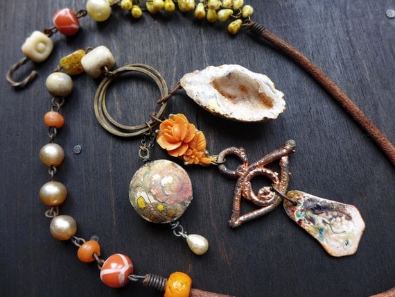 Gaudiloquent. Art bead necklace in primitive cream and orange. Rustic assemblage jewelry.