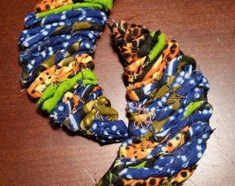 Leather "moonie" earrings with african fabric.
