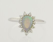 Popular items for opal halo ring on Etsy