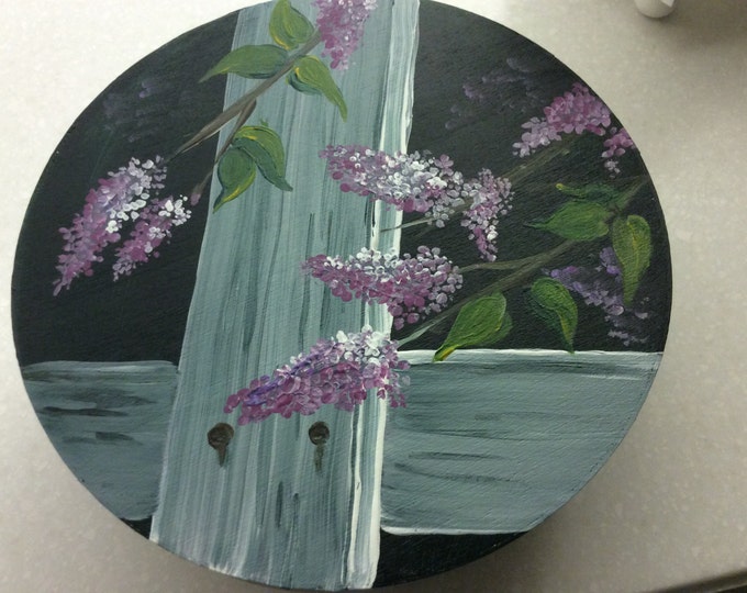 Round wooden box with lilacs painted on top