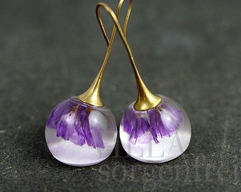 Real larkspur earrings. Purple real flowers in resin spheres. Brass gold earwires. Big earrings. Gift for her.