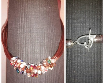 Unique, Vintage, soft colored beads with silky cord.