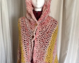 OH so soft hooded, open front Poncho. Shades of pink and yellow. Home spun yarn. Light and beautiful. Great spring accessory.
