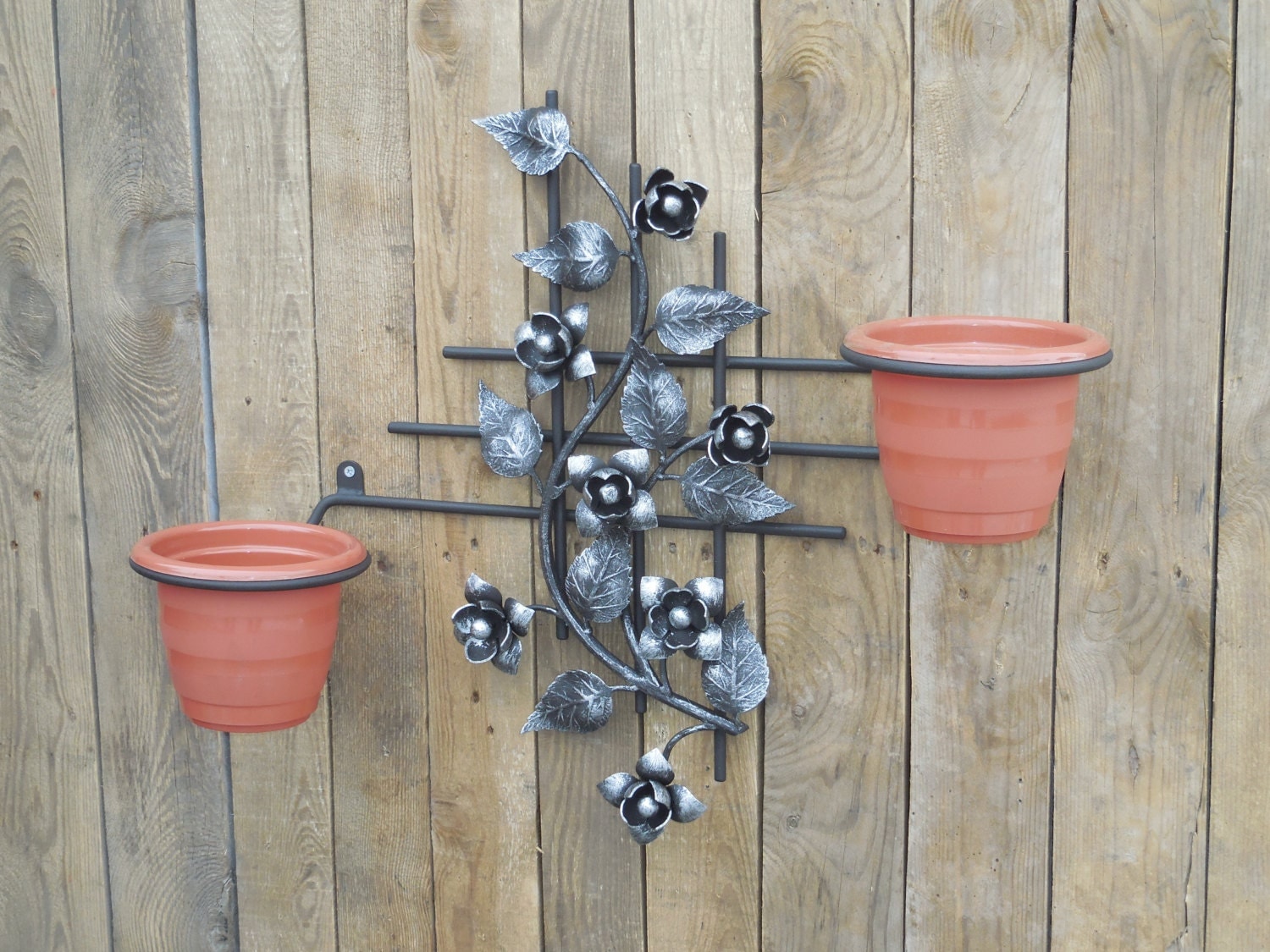 Wrought iron wall plant holder Idea