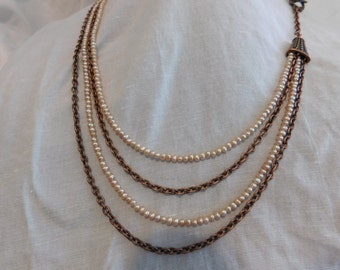 Freshwater pearls and antique copper chain.
