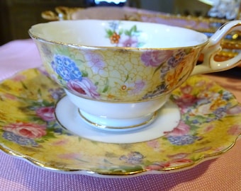 Occupied Japan Chintz Floral Footed TEA CUP & SAUCER