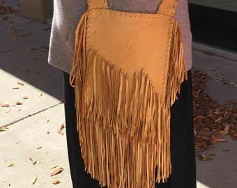 Fringed gold deerskin purse hand laced