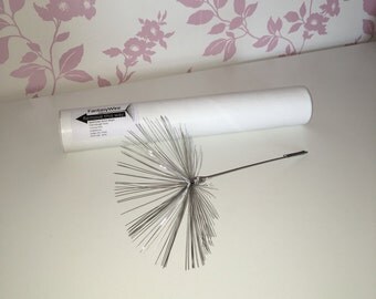 A wire sculpture of a 'Fairy Wish', an individual dandelion seed made out of stainless steel